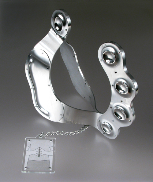 A hand-patterned metal tool, to be pressed between two palms and with dotted-indentations for placing each fingertip.