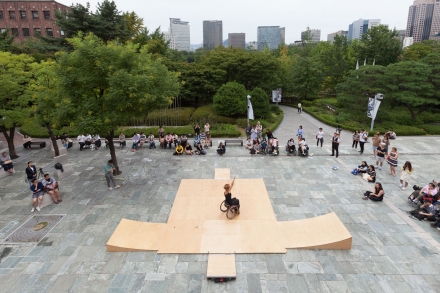 Alice dances on six tiles and four ramps at the opening of Media City Seoul. The platform kit is a wooden modular stage for ramped dancing.